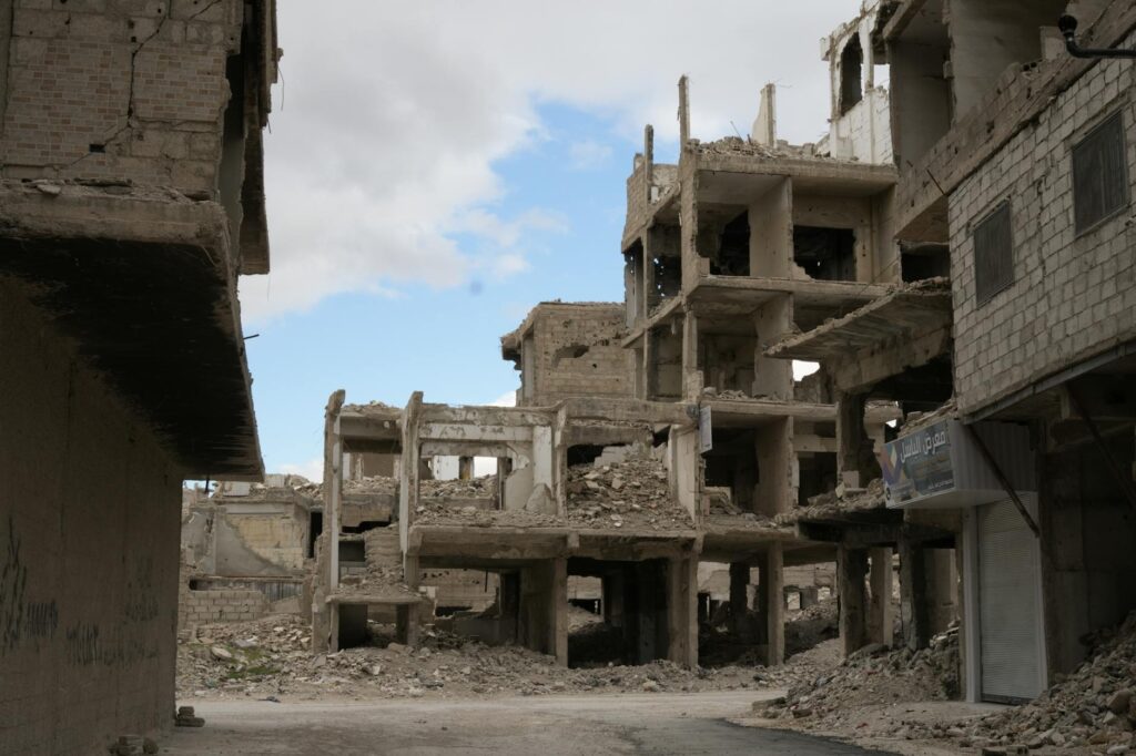 A haunting view of abandoned and destroyed buildings in Damascus, reflecting the impact of conflict.