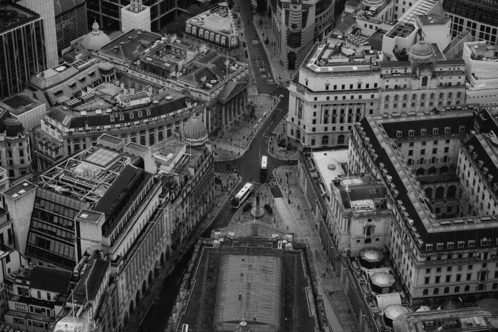 Black and white aerial shot of London's iconic financial district with historic architecture.