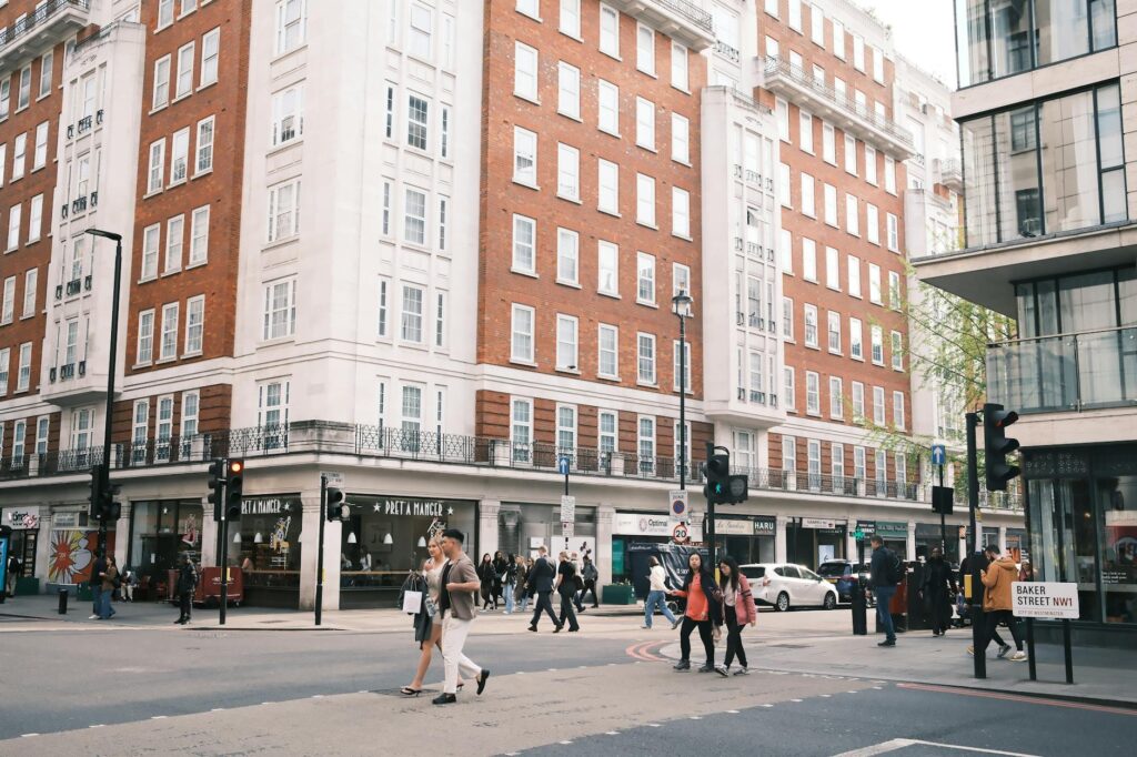 A bustling street scene at Baker Street, London, capturing urban life and architecture.