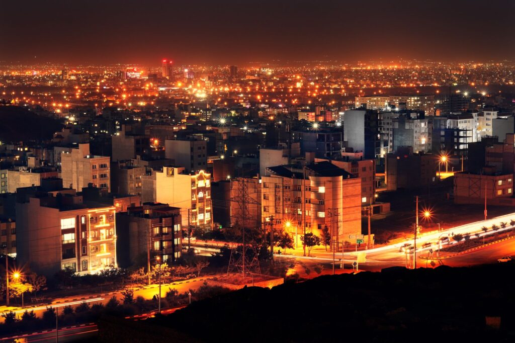 A breathtaking aerial view of Mashhad city lights at night, showcasing the urban landscape of Iran.