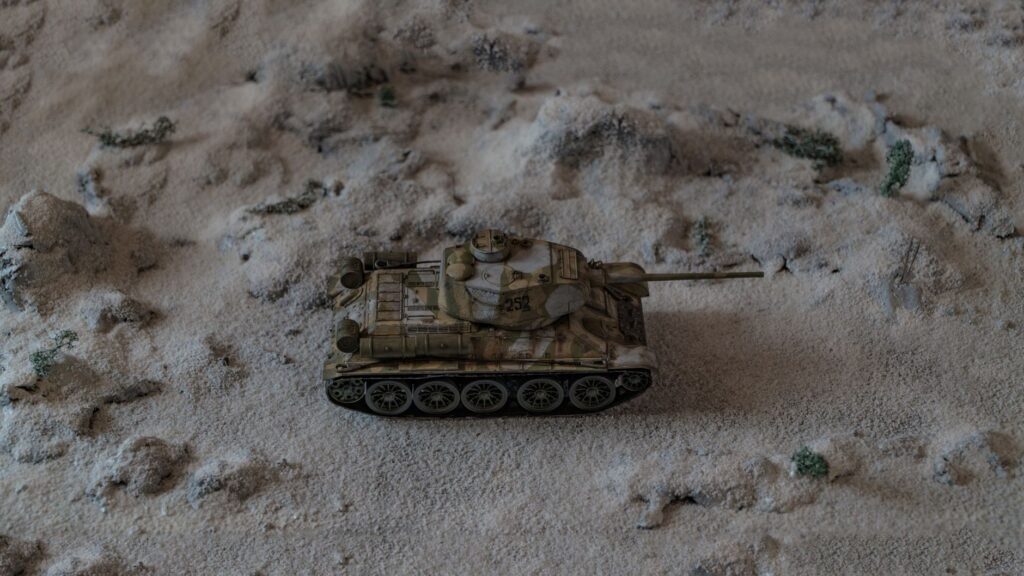 Detailed diorama featuring a miniature tank on a snowy battlefield.
