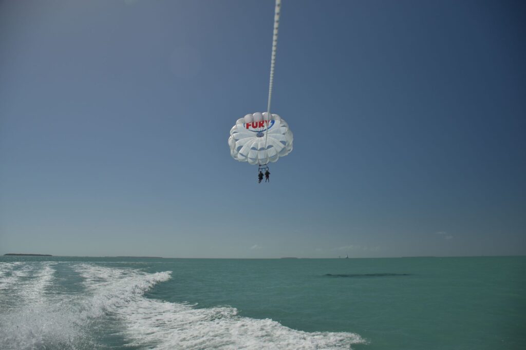 Experience thrilling parasailing over turquoise waters in Key West, Florida.