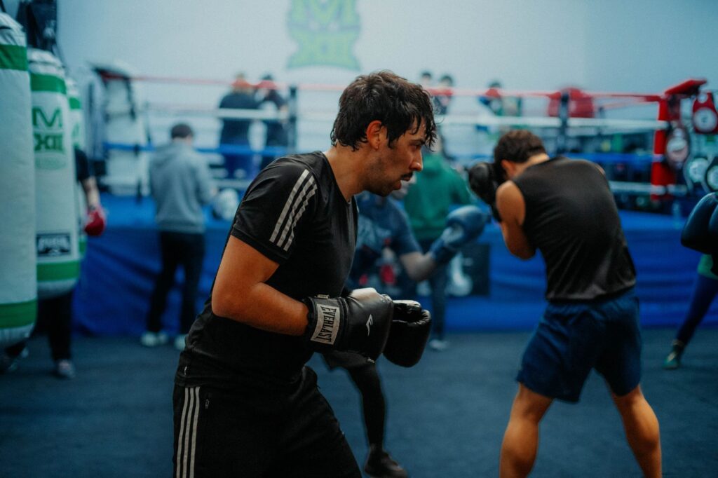 Boxers engaged in a rigorous training session inside a Buenos Aires gym.